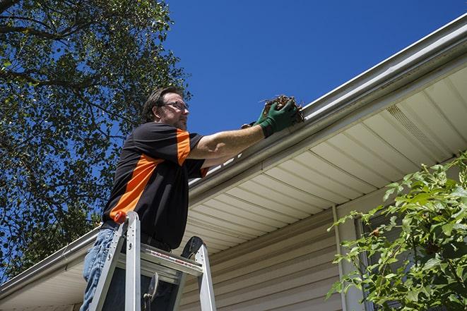 a close-up of a detached gutter needing repair in Des Plaines, IL